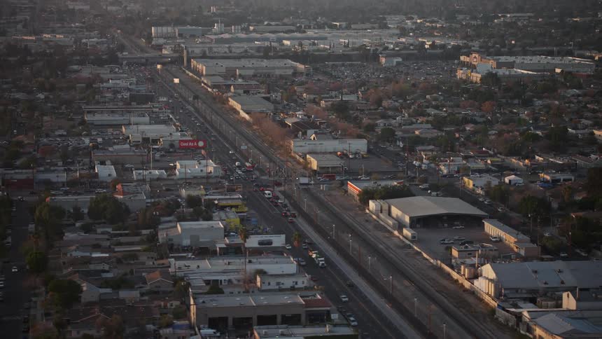 Aerial panorama of a highway in an urban city with vehicle traffic