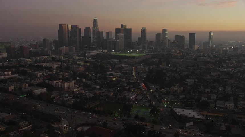 Aerial panorama of a metropolitan city with skyscrapers in a late afternoon