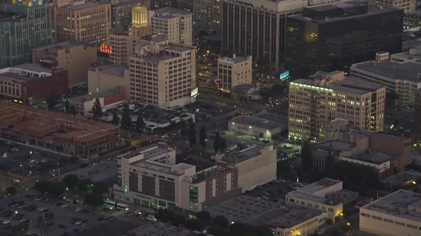 Helicopter flying over a metropolis at dusk