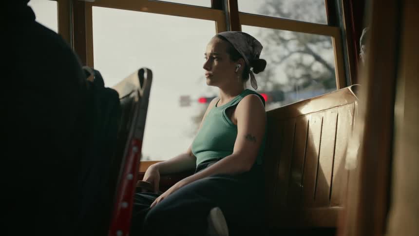 A woman is riding the bus