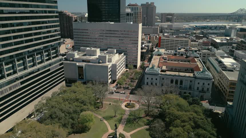 Aerial view of a cityscape with modern and a small park