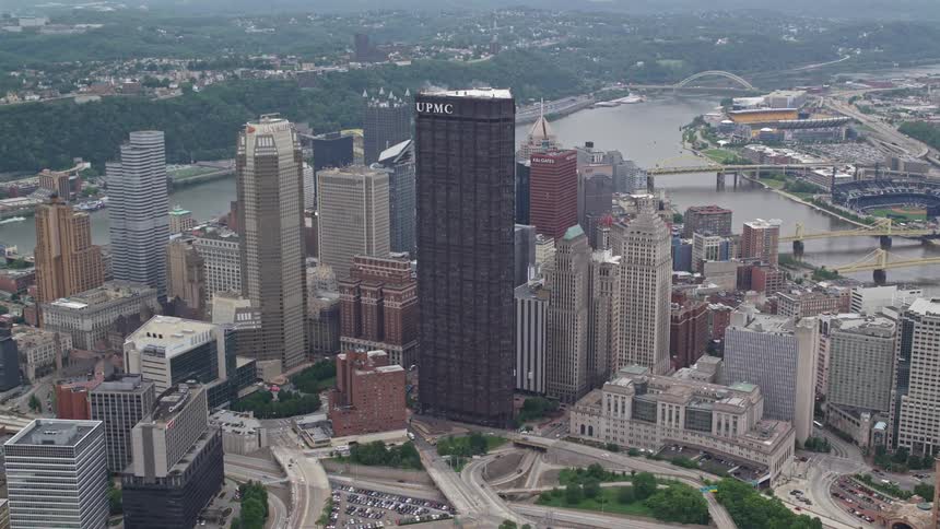 Aerial panorama of a metropolis with commercial buildings and skyscrapers on the edge of a river canal