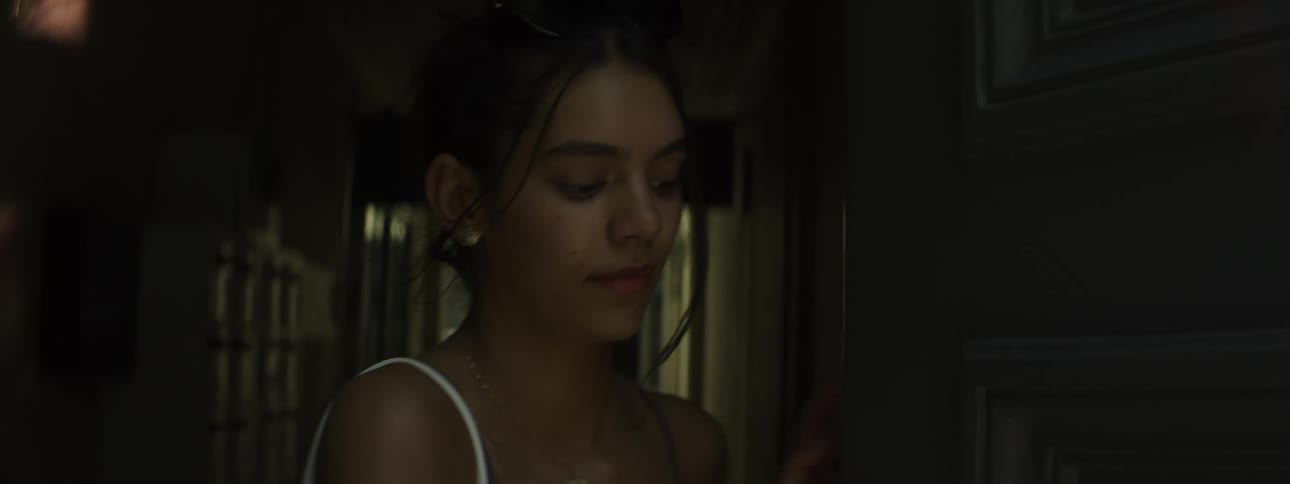 A teenage girl leaves a building