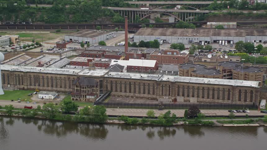 Aerial panorama of the facade of a riverside complex