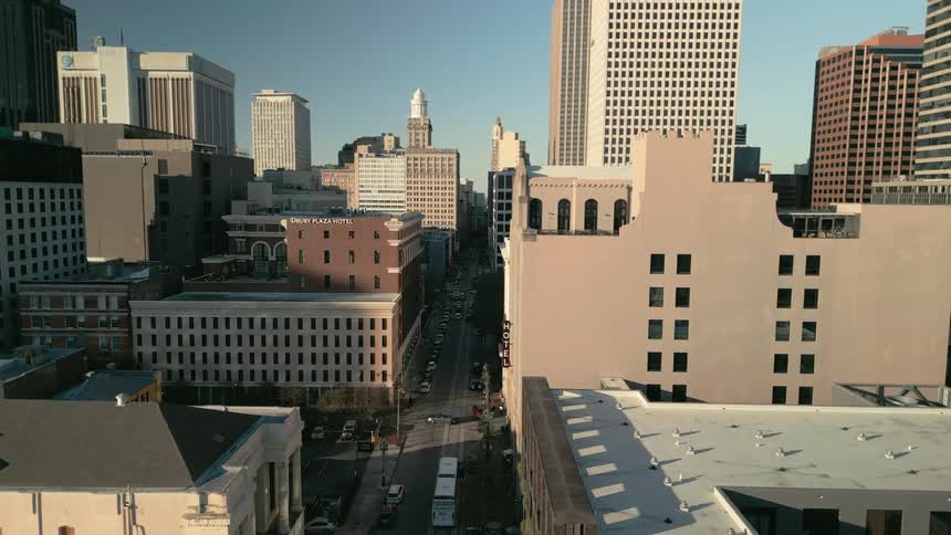 Daytime urban view with various architectural styles under a blue sky
