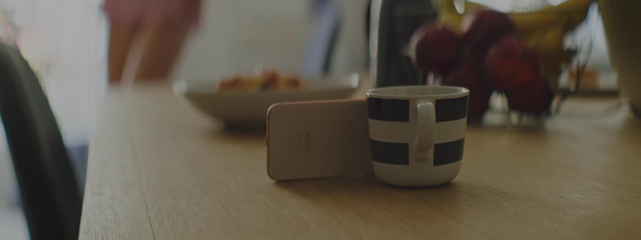 A woman walks over to get her coffee cup