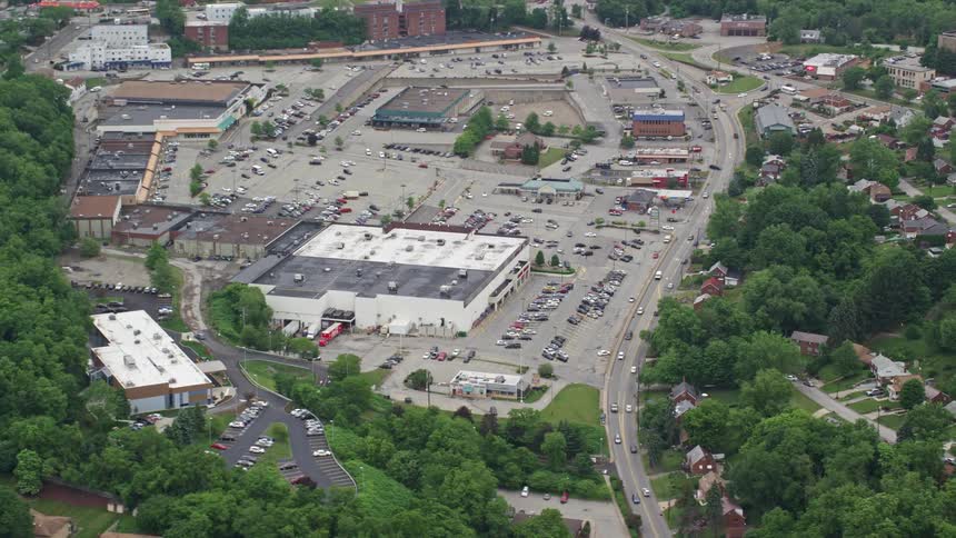Buildings and a busy road in a suburb
