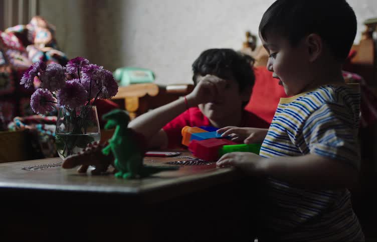 Two children are playing with toys