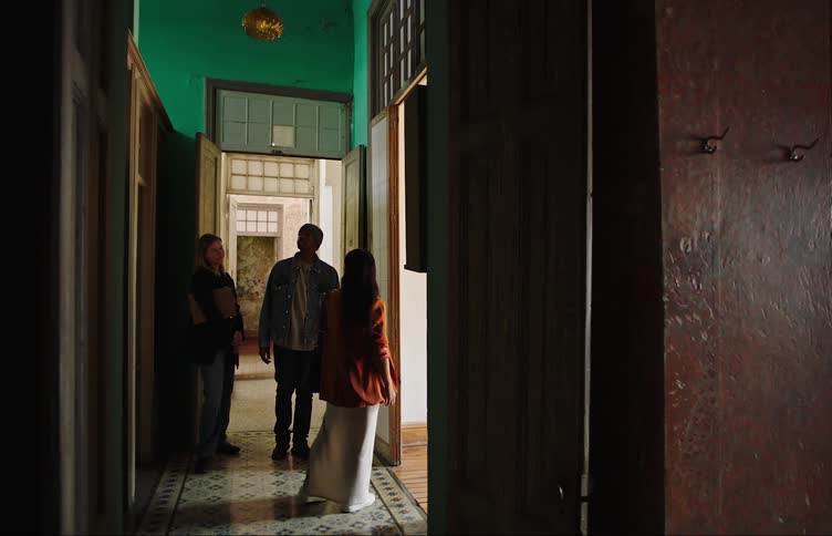 A person shows an apartment to a couple
