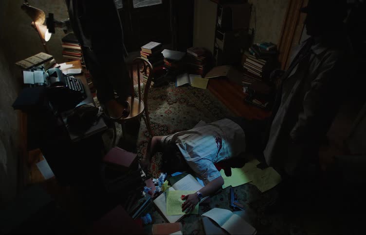 A clip of dead person in a room with two inspectors