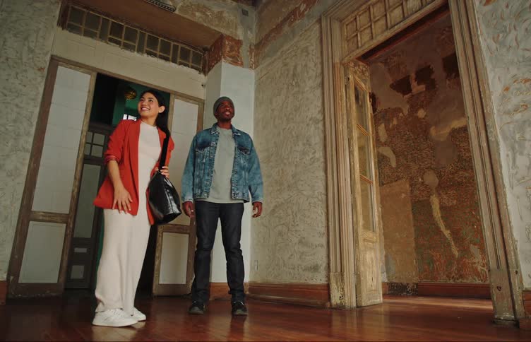 A man and woman look at an apartment together