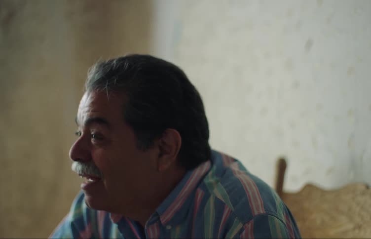 A man is talking and moving his hands around