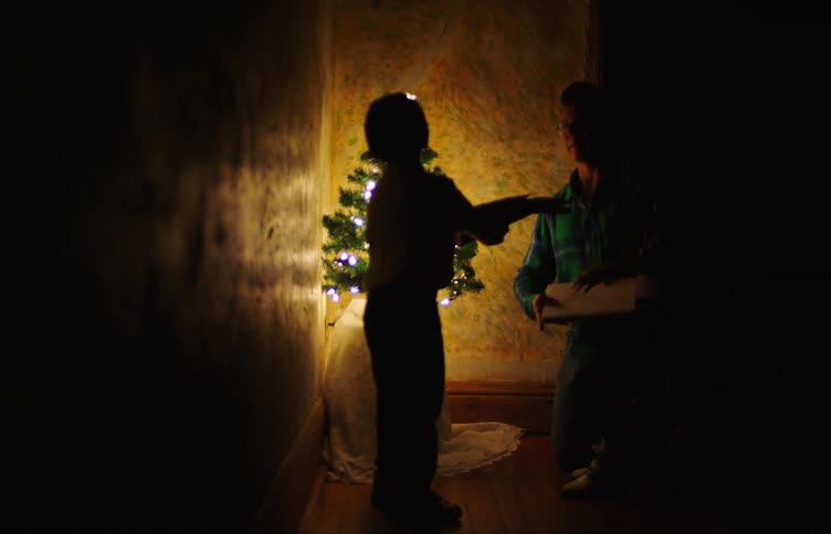 A father and his children celebrate christmas