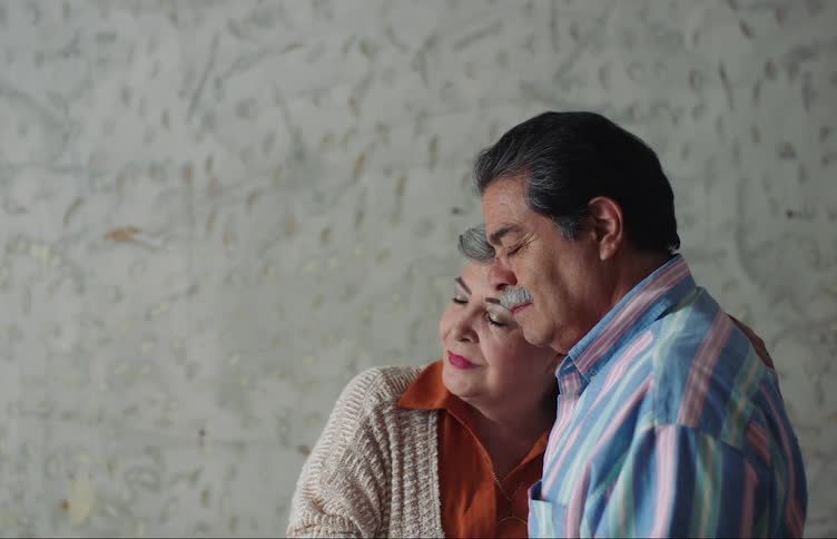 A couple with closed eyes embrace