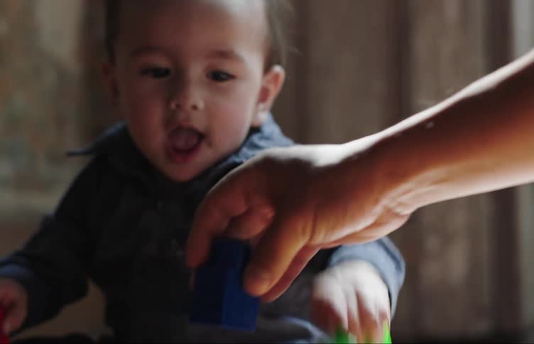 A child is playing with toys