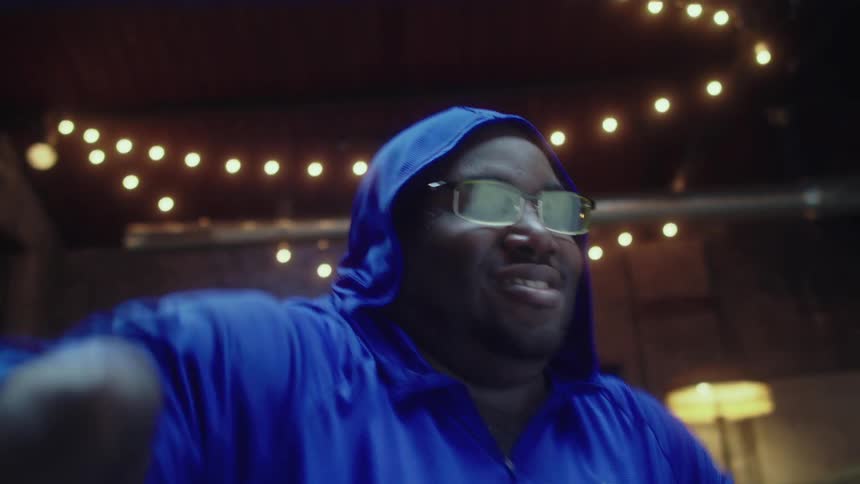 Energetic disabled man dances on a spacious room