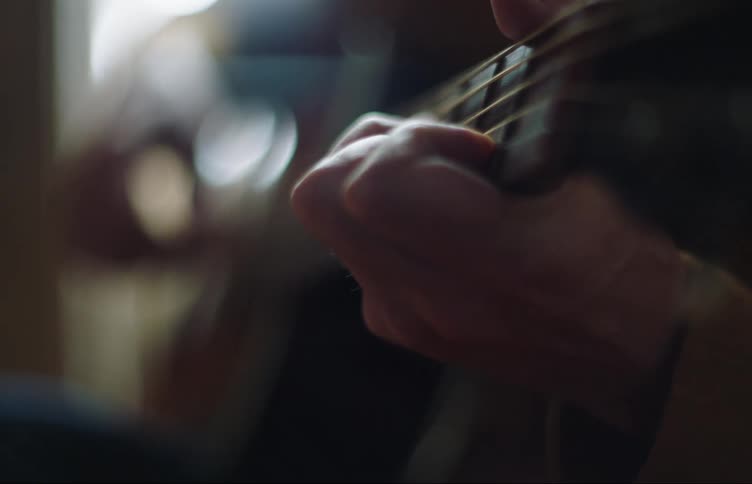 A person is playing the guitar