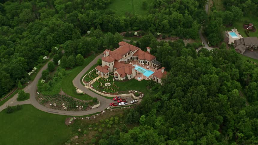 Aerial panorama of resort on a hill in a mountain surrounded by vegetation