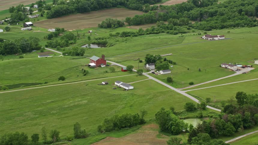 Aerial view of a countryside landscape with houses and farmlands