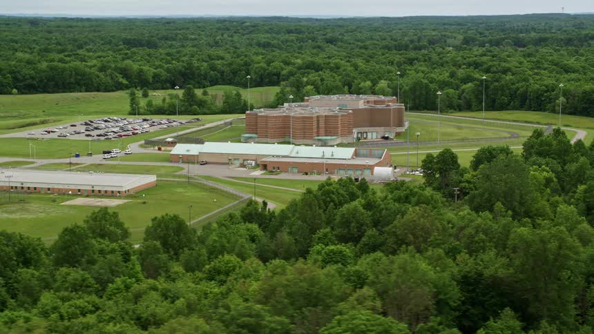 A campus sits in a clearing