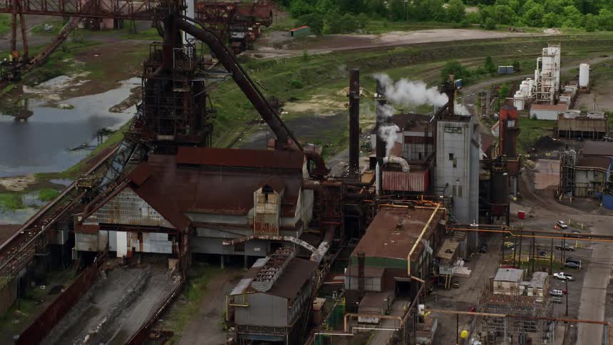 Aerial panorama of an industry on the edge of a lake channel