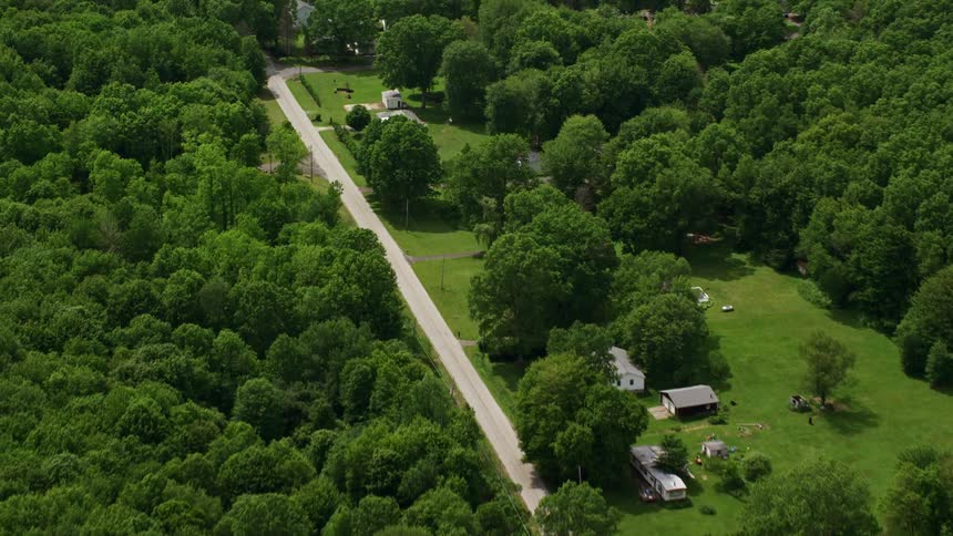 A few homes are on the road running through the landscape