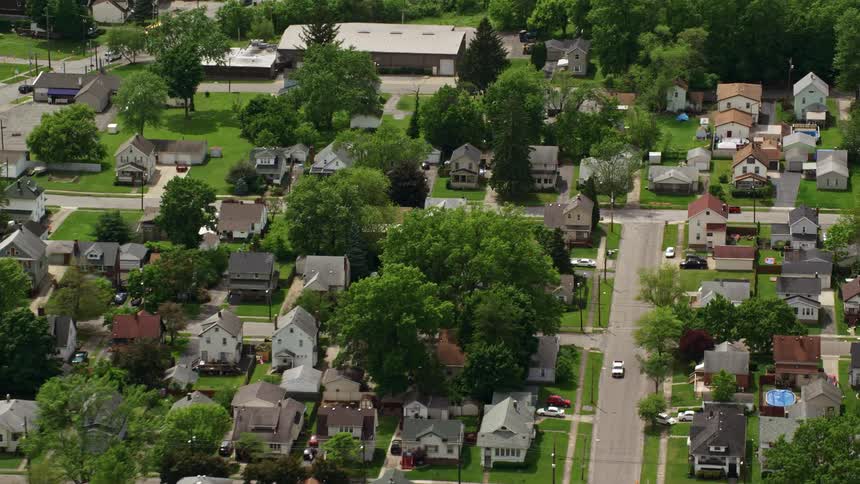 Aerial panorama of an urban city in a residential neighborhood with vegetation