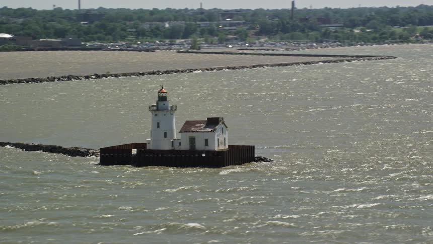 Lighthouses sit off a shoreline
