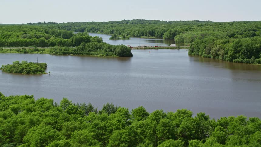 The land on the river are full of trees