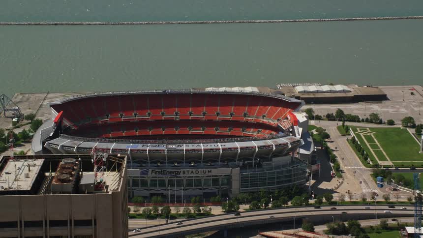 A stadium in a city on a coast