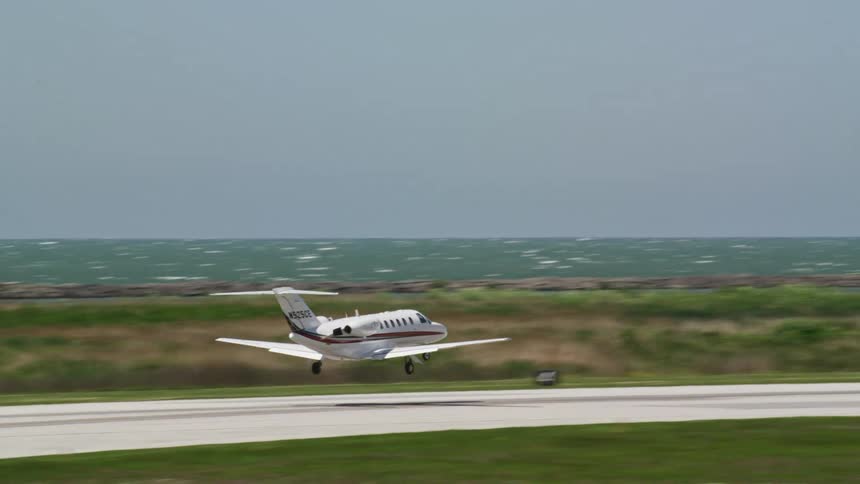 A jet plane takes off from an airport runway