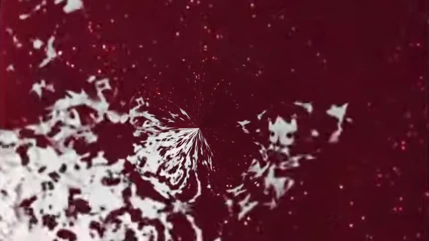 The white ink moves around on the red