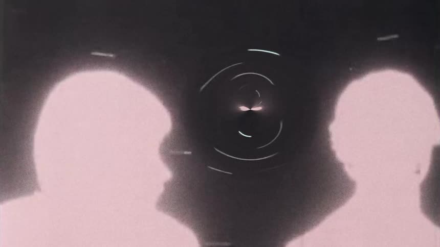 Silhouette of two people on grainy footage