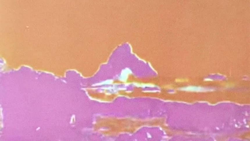 The shore is filmed in a negative
