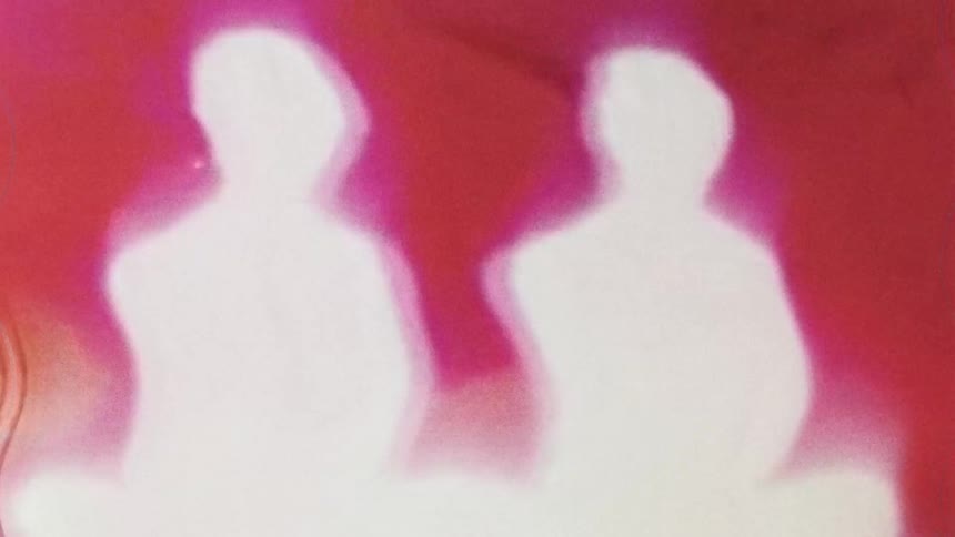 Pink colors in liquid form are mixed together