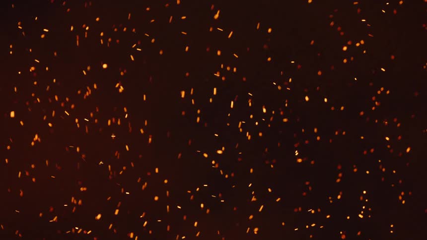 A fire throws off scads of burning embers