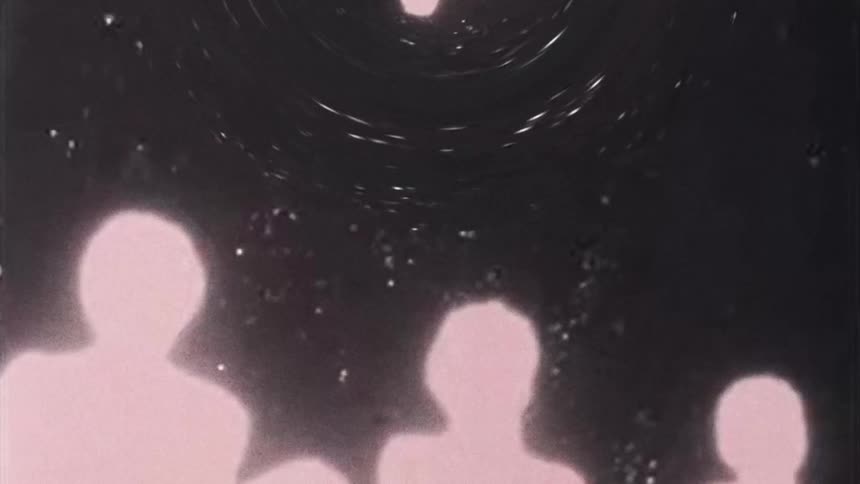 Three beings of light as specks of light circle above them