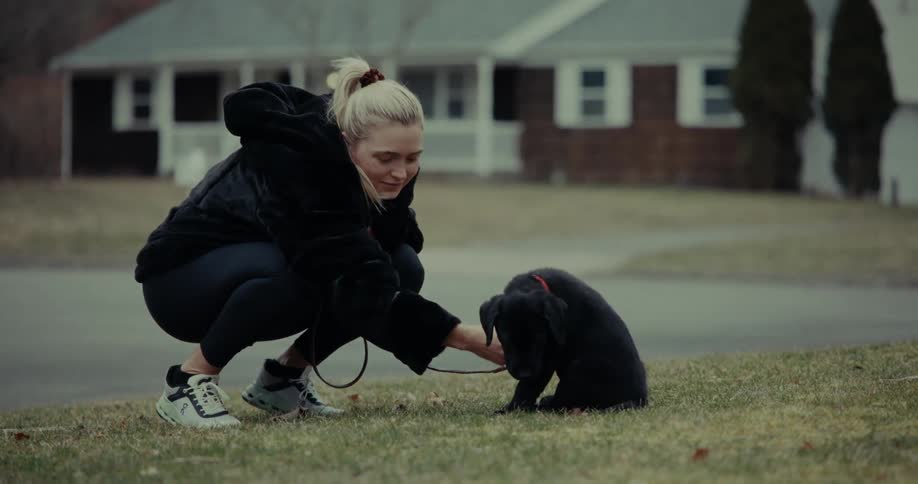 Woman outdoors playing with her dog during spring time