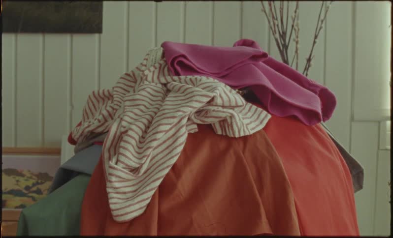 A pile of clothing in a room