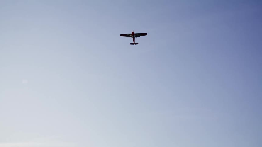 A clip of a plane flying up above the river