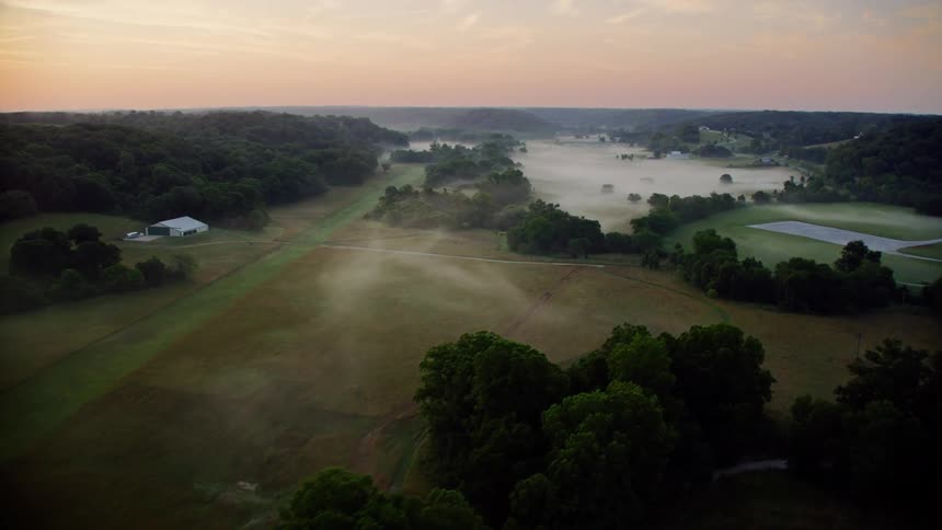 The landscape is covered with fog