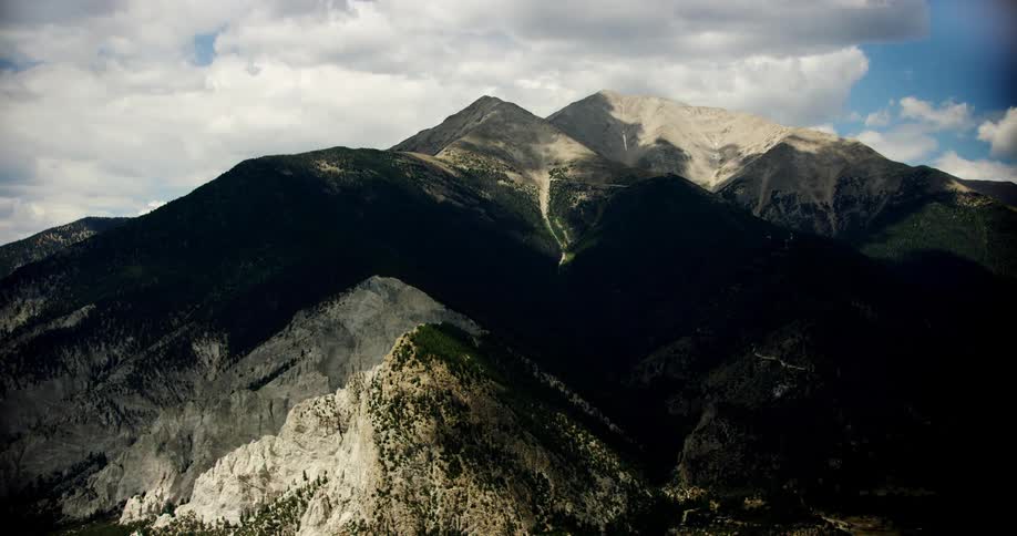 Shadows cover a large mountain range