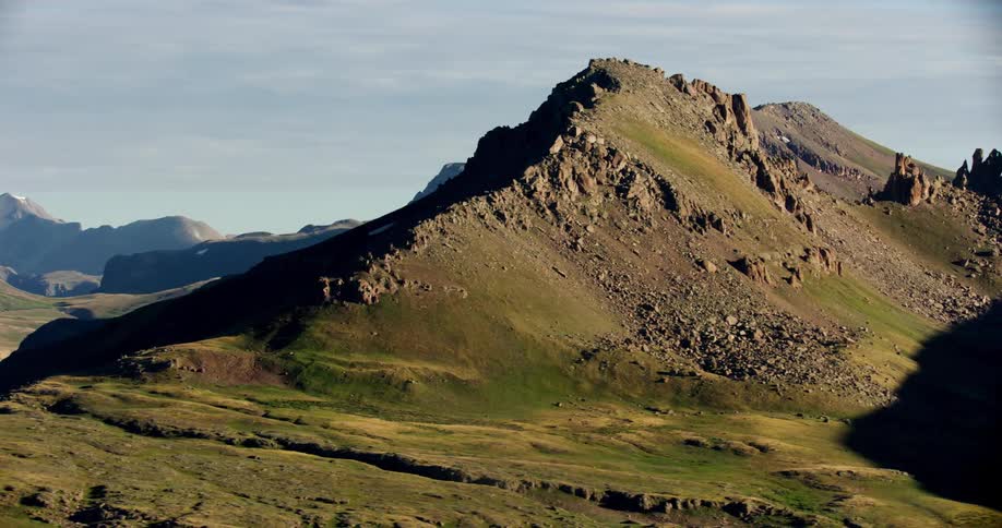 Aerial landscape of mountains with mosses and rocks on a blue sky day with clouds