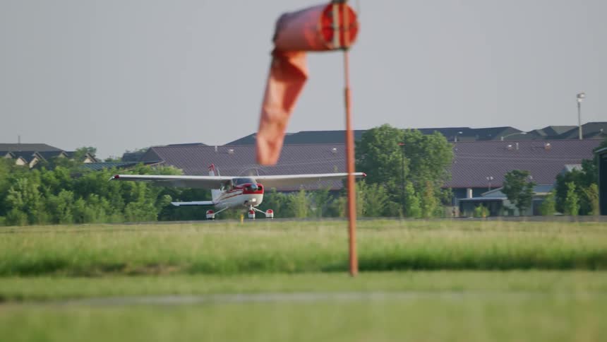 A small plane taxis down a runway