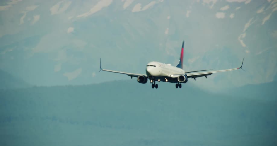 A plane begins a landing