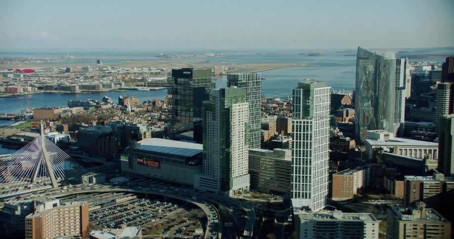 A busy city with tall skyscrapers on a clear sky day