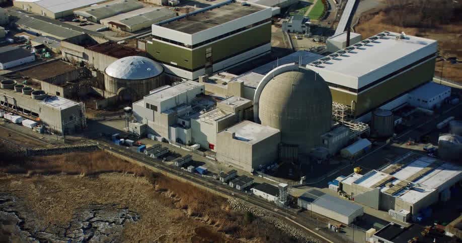 Aerial panorama of warehouses in a factory and a power plant in an isolated location