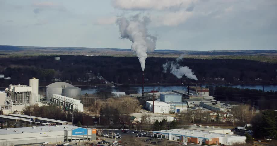 An exterior shot of a power plant factory and other businesses