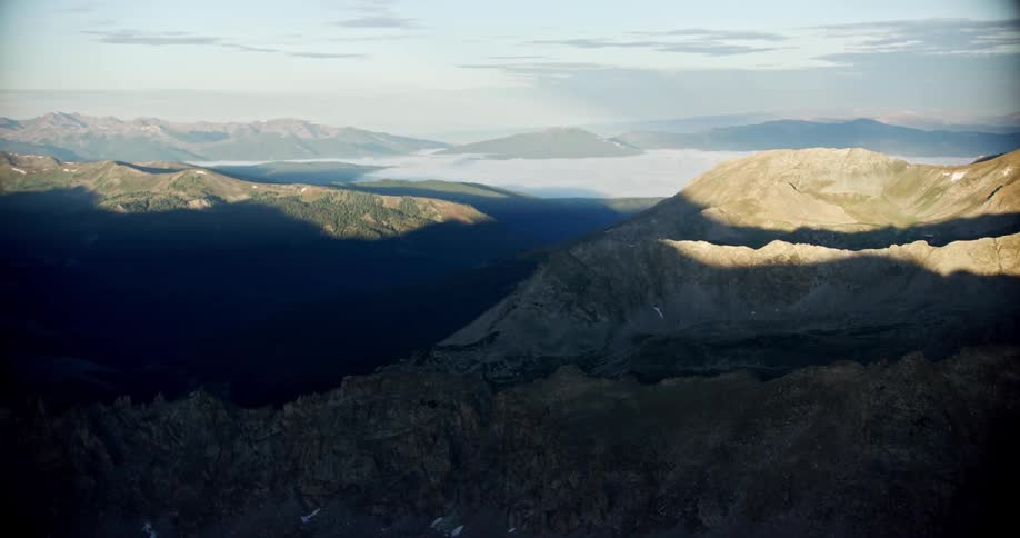 Aerial of a mountain range on a partly sunny day