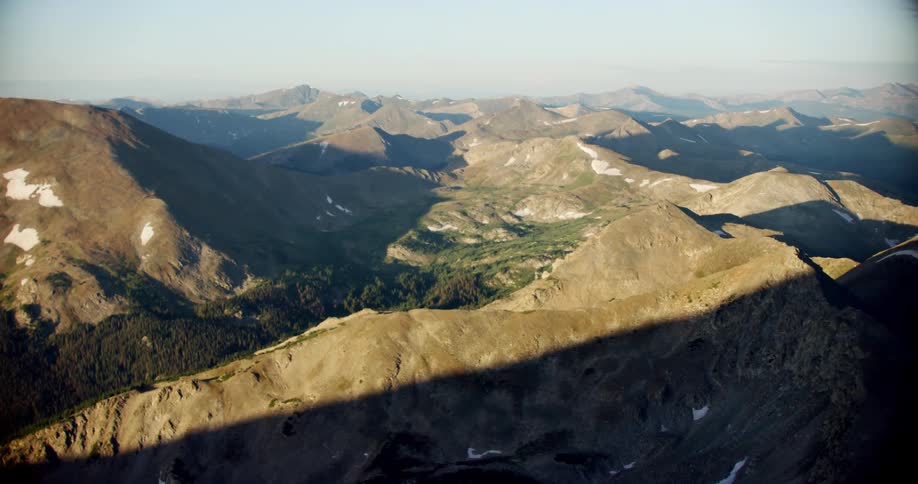 A forest grows in a mountain valley